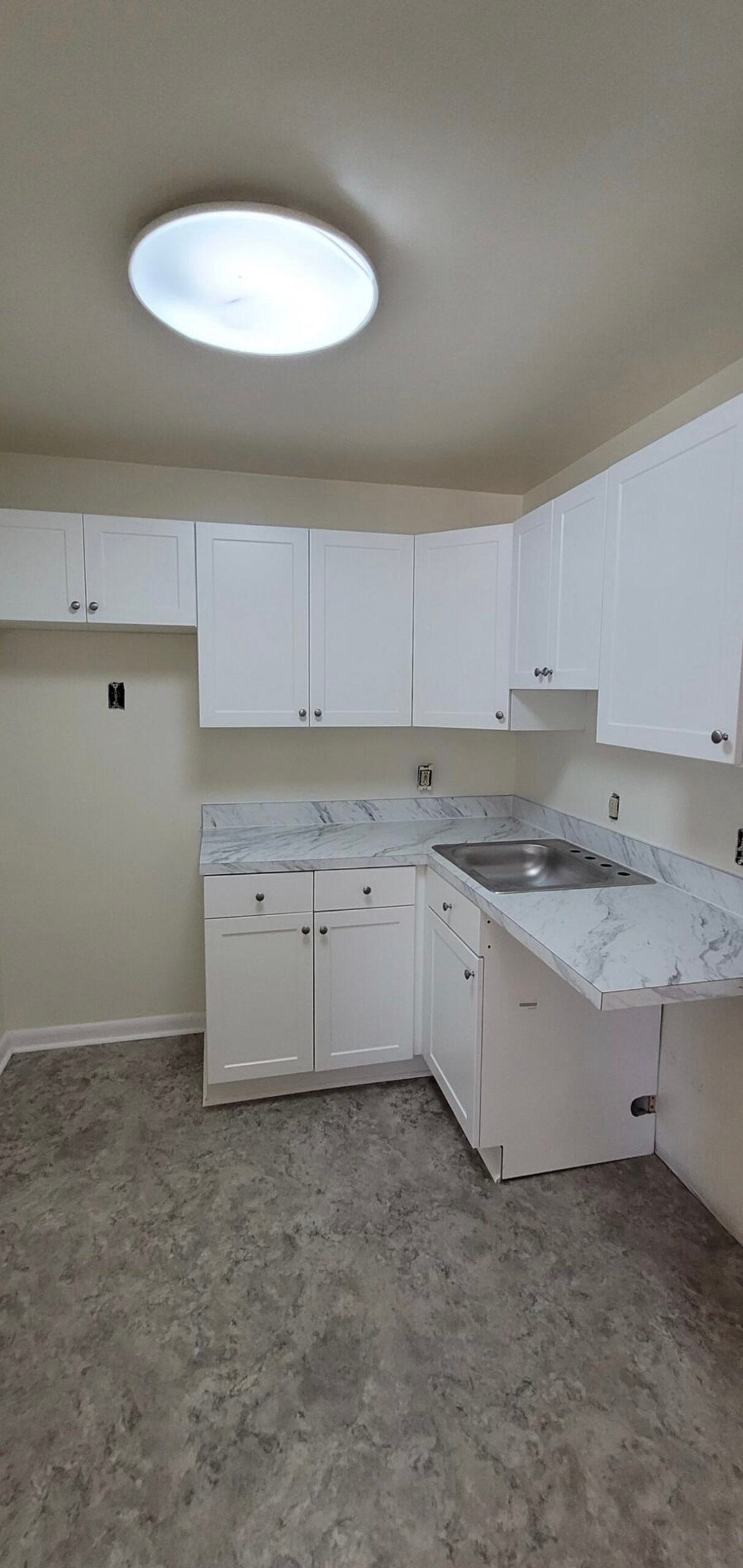 Before — basic white-cabinet Arlington VA kitchen prior to remodel
