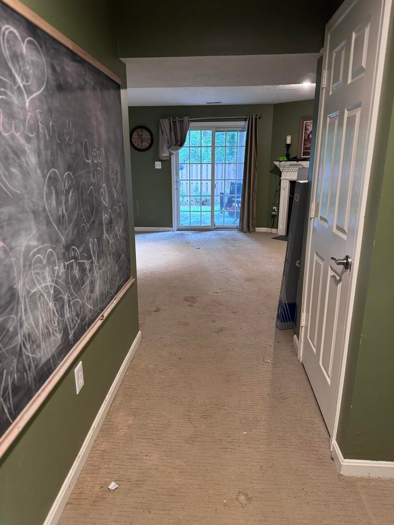 Basement floor before luxury vinyl plank installation in Arlington, VA
