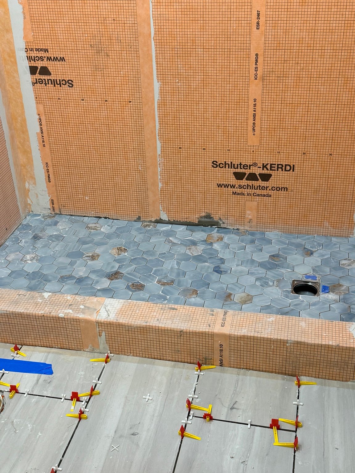 Schluter KERDI shower waterproofing installed before tile on a Prime Build Solution bathroom remodel in Arlington VA