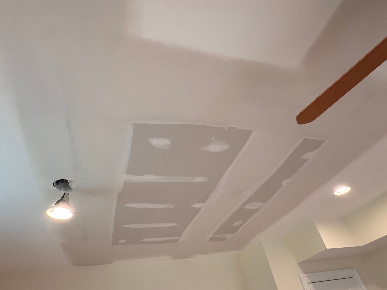 Ceiling drywall repair in progress after water damage in Arlington, VA